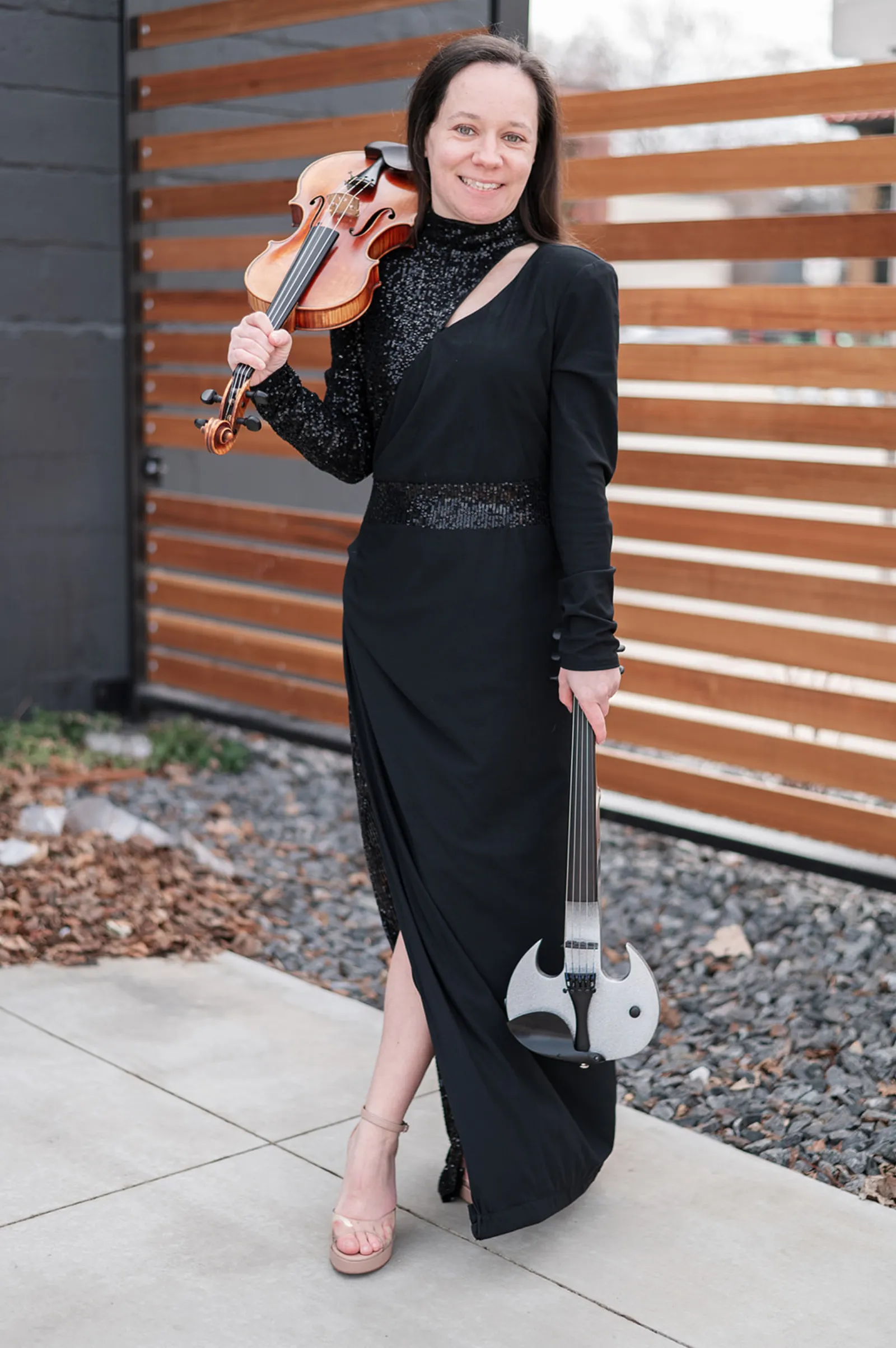Ashley Rewolinski with her acoustic and white electric violins